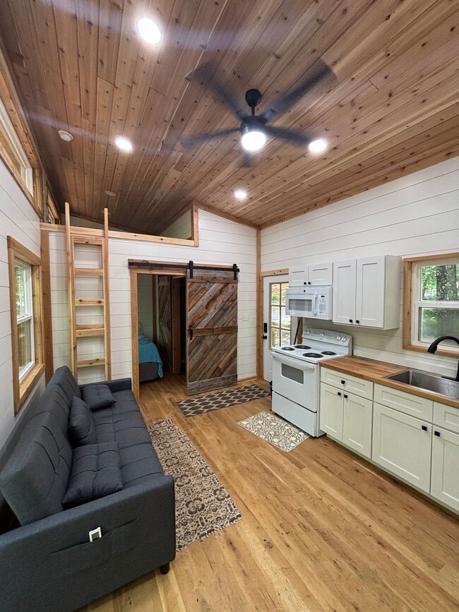 Building Photo - Cozy, Modern Tiny Home with Wrap-Around Po...