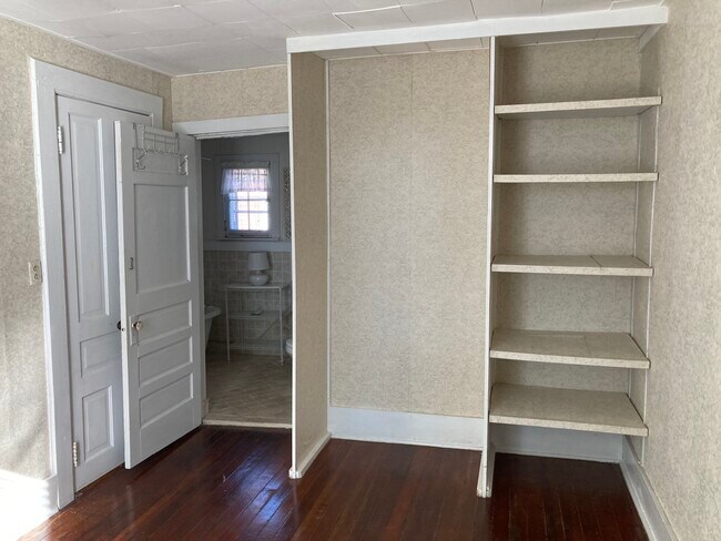 Bedroom with closet and open shelving - 317 Eagle St