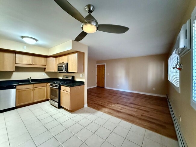 Building Photo - Pristine 2 Bedroom, 1 Bathroom Condo Available NOW! Heat, Water, & Parking INCLUDED in Rent!