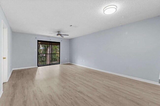 Building Photo - Freshly Updated 2BR Condo with Private Balcony, Community Pool, & In-Unit Laundry