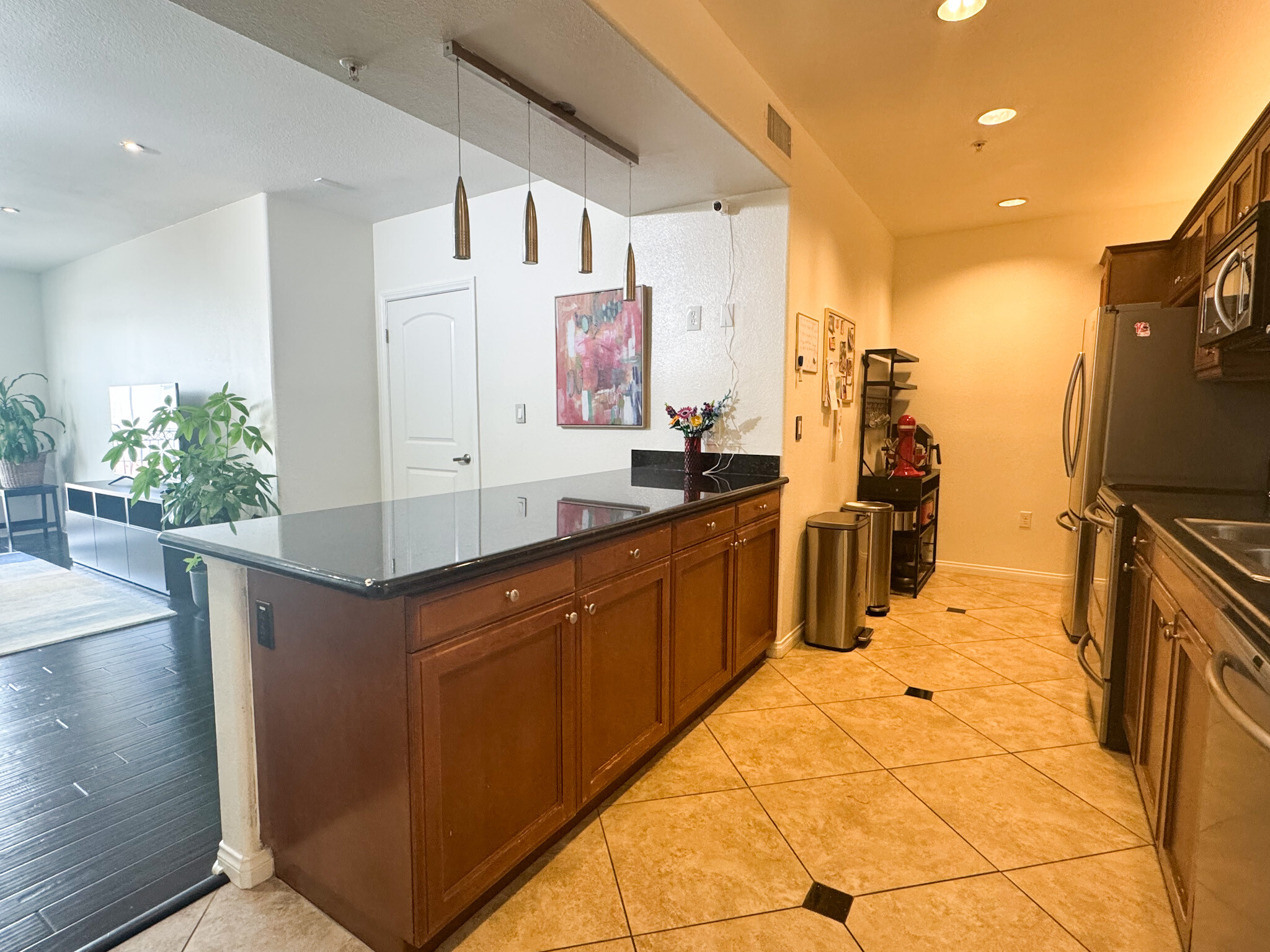 Gourmet kitchen with granite counters and stainless appliances - 3740 Santa Rosalia Dr