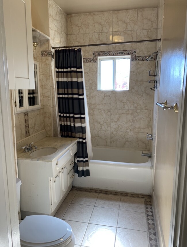 Bathroom w/ Vanity & Marble Shower - 8820 Alcott St