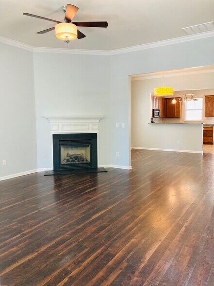 Spacious living area with gas fireplace - 133 Kensington St