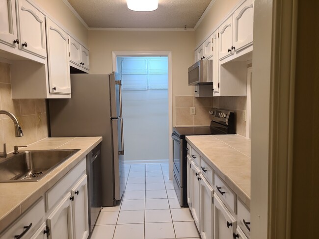 Galley Kitchen with SS Appliances - 12435 Coursey Blvd