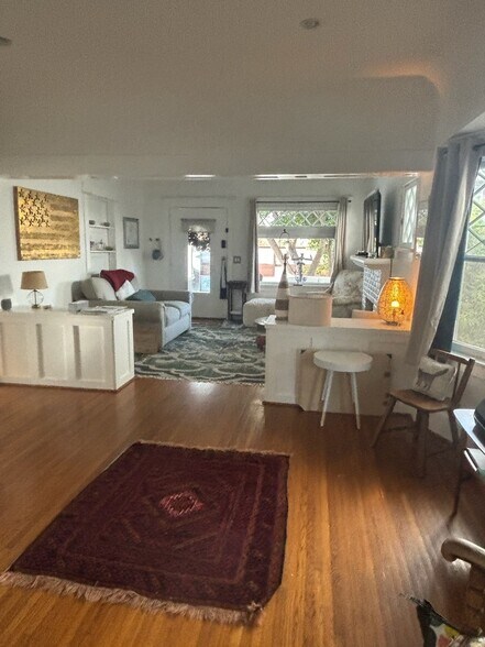 Large, open-concept living and dining area with plenty of natural light. - 6000 Carlton Way