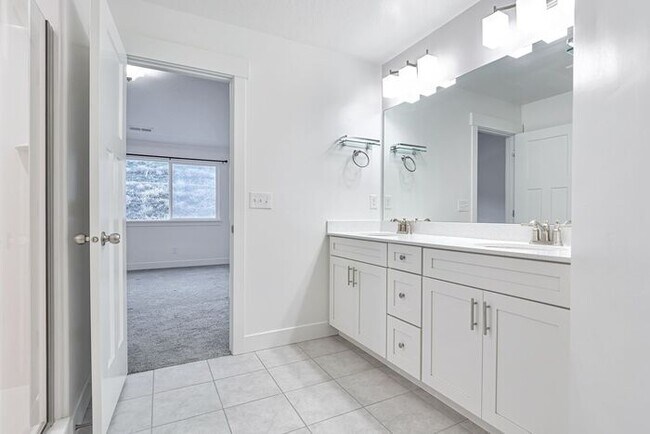 Building Photo - ROW END TOWNHOUSE W 2 CAR GARAGE + AMENITIES