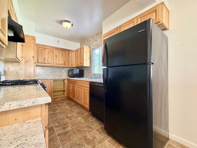 Building Photo - Inviting Holladay Home with Large Yard, Carport & Extra Parking