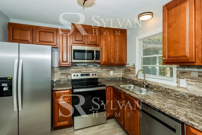 Building Photo - Lease today! No extra charge for contentme...