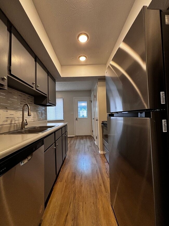 Building Photo - Charming 2-Bed, 1.5-Bath Condo with Carpor...