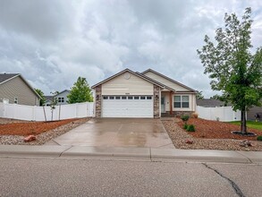 Building Photo - Spacious Wellington Home with Fenced Yard & Two-Car Garage