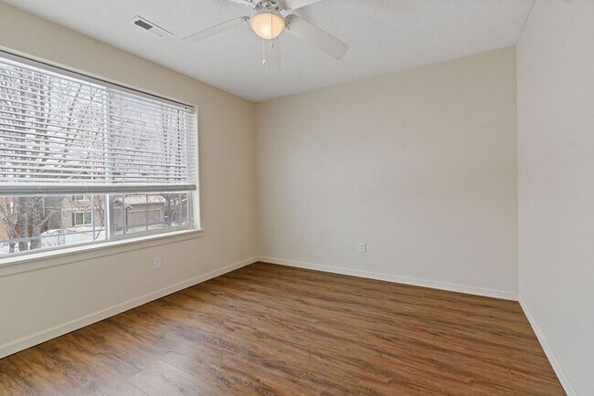 Building Photo - SPACIOUS LAYOUT! HARD SURFACE FLOORING, FENCED YARD & LARGE PATIO!