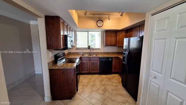 Building Photo - 2 br, 2 bath Condo - 6417 La Costa Dr Apt 205