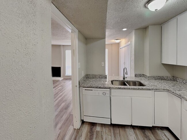 Building Photo - Stylish Upstairs Condo with Fireplace, Pri...
