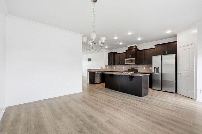 Building Photo - Modern 4BR Townhome with Washer/Dryer & Pet-Friendly Living in Morrisville!