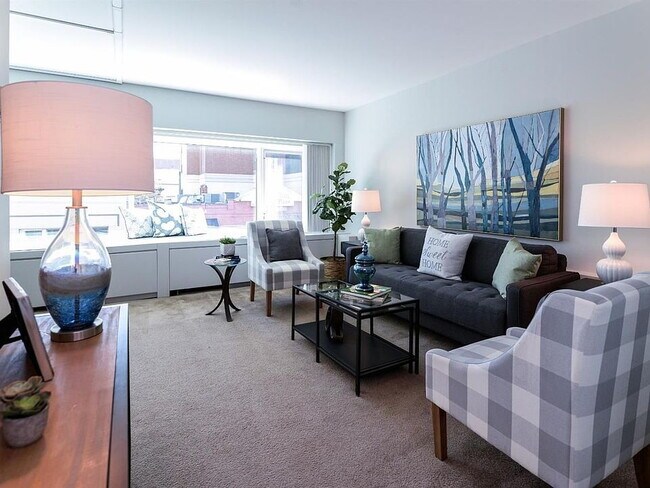 Building Photo - "Chic Urban Living: Cozy 1-Bedroom Condo w...