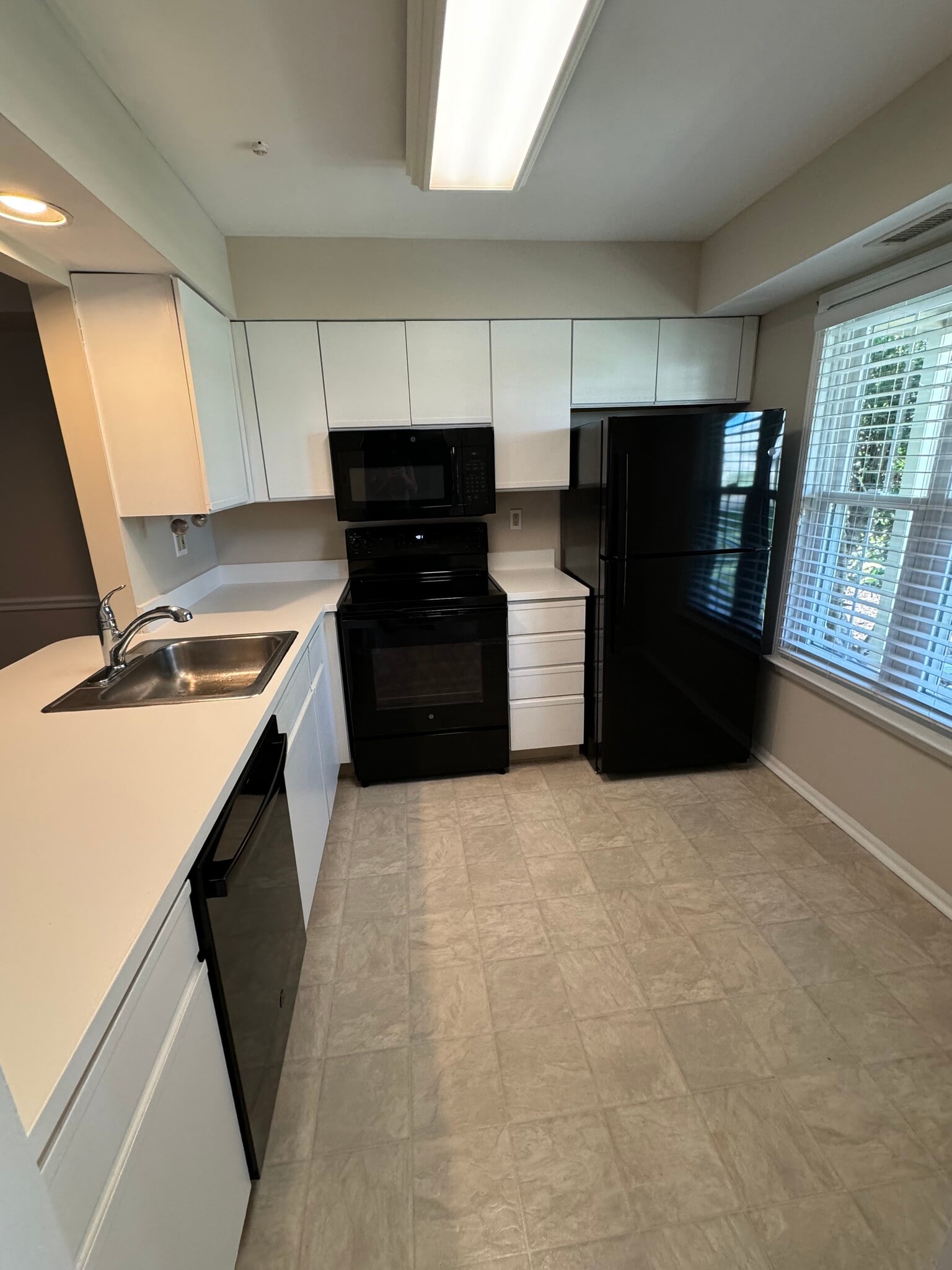 Kitchen with new appliances and freshly painted cabinets - 2103 Society Pl