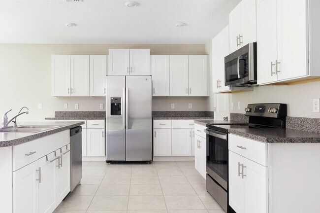 Building Photo - Spacious 5-Bed Touchstone Home – Primary Suite Downstairs, 2-Car Garage