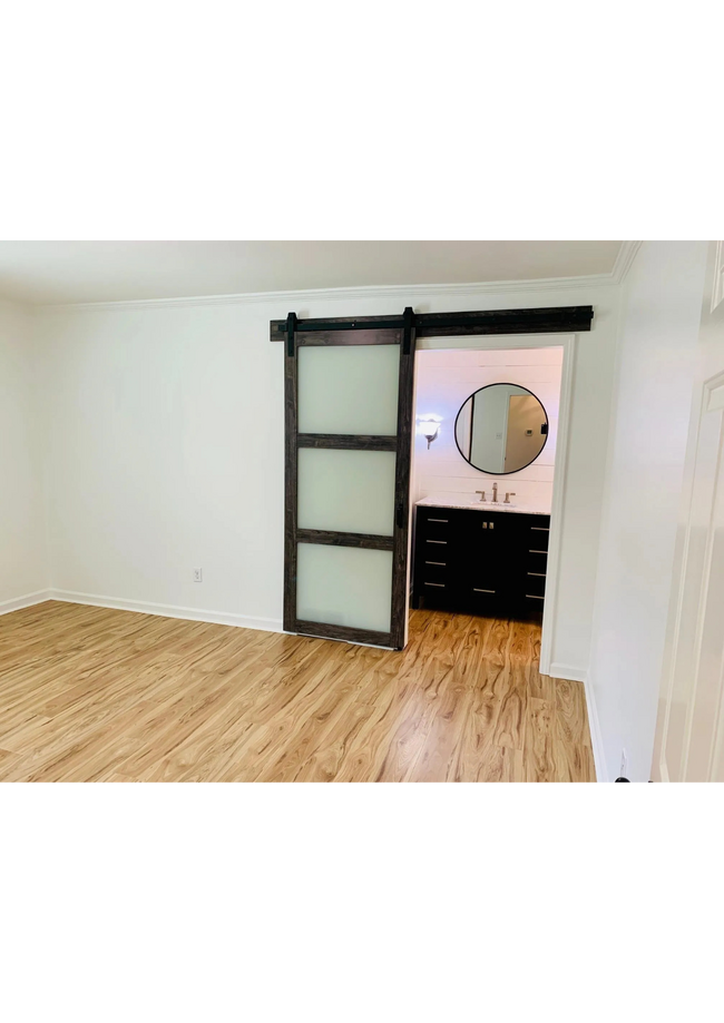 Barn Entryway into spacious bathroom - 1602 Bubbling Brook Dr