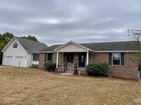 Building Photo - Spacious 4-Bedroom Home with Bonus Suite i...
