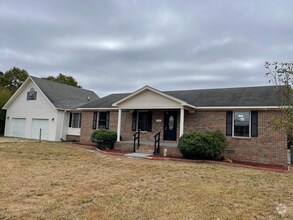 Building Photo - Spacious 4-Bedroom Home with Bonus Suite i...
