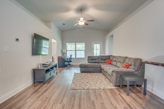 Building Photo - Spacious 4BR/2BA Brick Home with 2-Car Garage, Granite Kitchen, Vaulted Ceilings & Fully Fenced B...