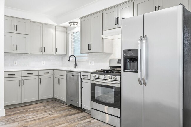 Building Photo - **$40K+ IN UPGRADES AND A FENCED BACKYARD WITH TWO STORAGE BUILDINGS**
