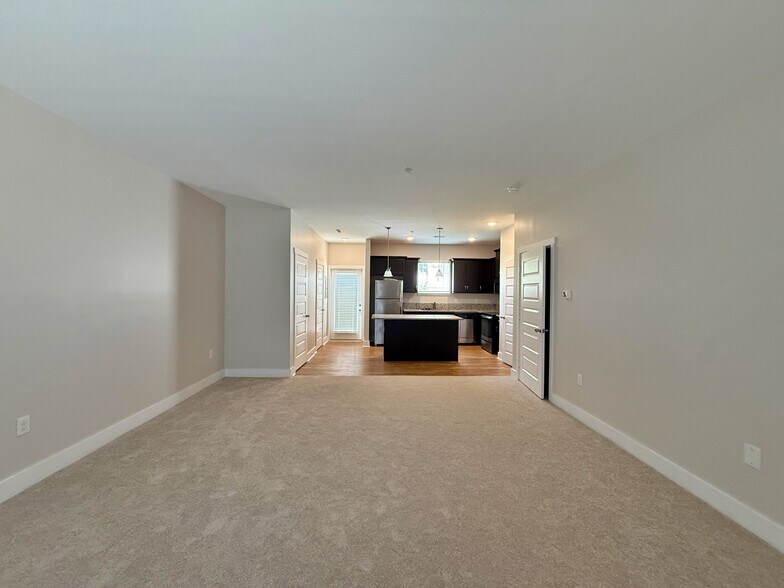 The large open floor plan flows seamlessly between the living and kitchen spaces. - 3010 Bellflower Cir