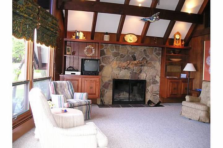 living room with wood burning fireplace - 5304 Lakeside Blvd