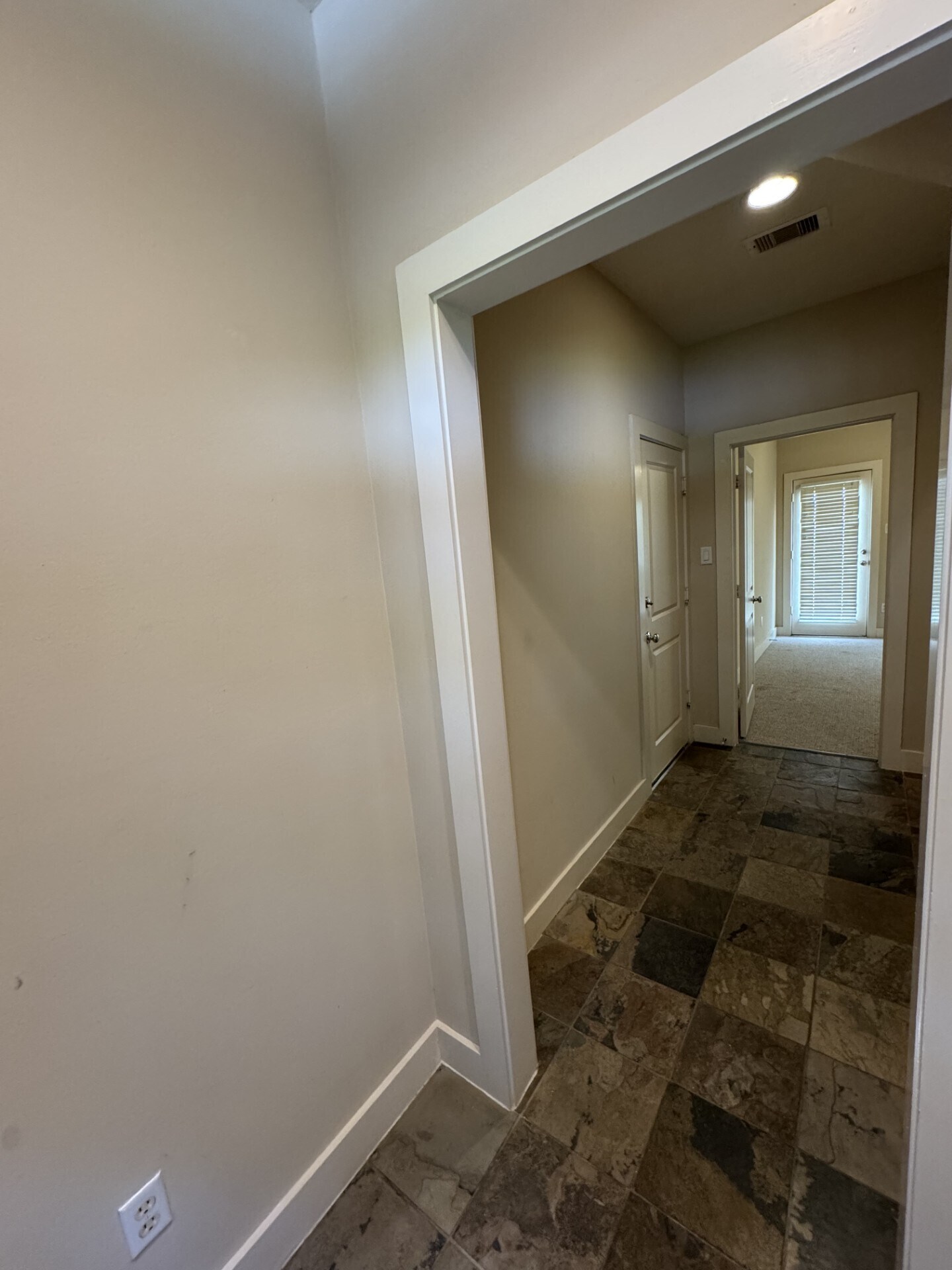 First floor hallway to secondary bedroom, slate tile - 855 W 25th St