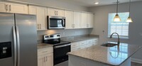 Building Photo - Newly built 3 bedroom/2 5 bath townhome lo...