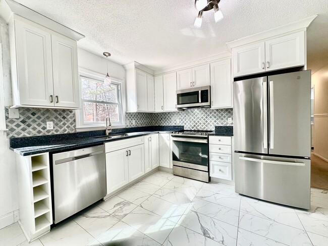 Building Photo - Updated 3BR Ranch | Large Lot, Deck & Modern Finishes – Minutes to Durham