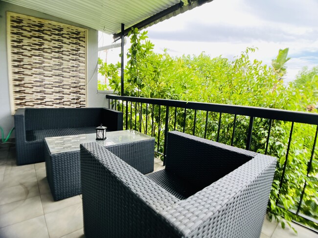 Second floor patio given privacy by mature fruit trees - 6301 Coldwater Canyon Ave