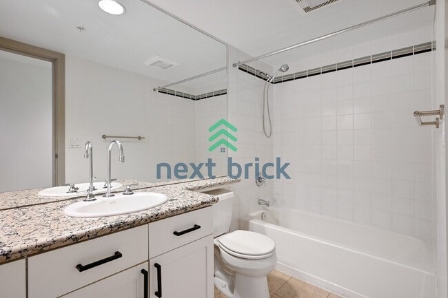 Building Photo - Stunning 2-Bed Corner Condo with Water and Mountain Views