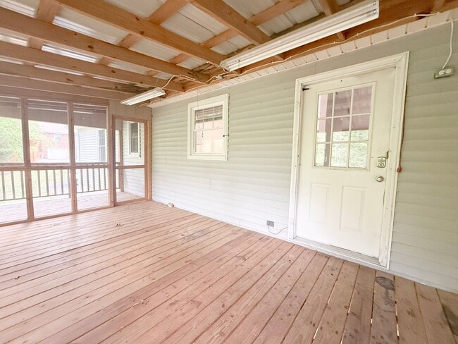 Building Photo - Spacious 3-Bedroom Home with Screened Porch, 2-Car Garage + Workshop