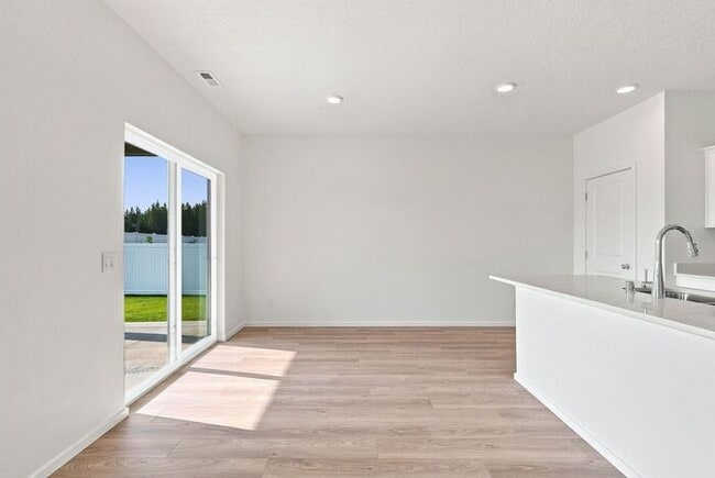 Building Photo - Modern 4-Bedroom Home with a 3-Car Garage & Covered Patio