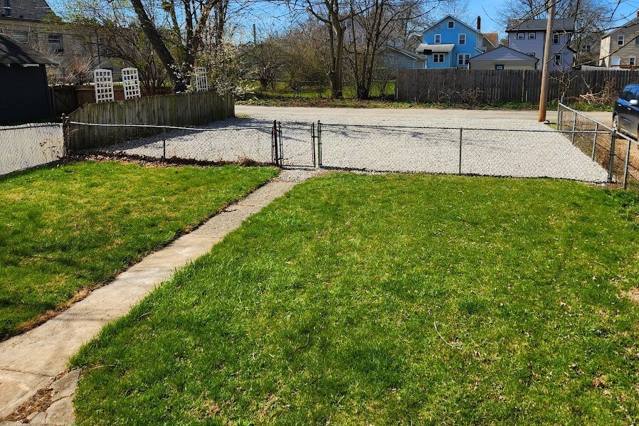 New gravel parking area - 2 spaces for each unit - 43 N Roys Ave