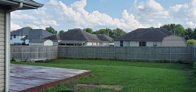 Privacy fence with gate. - 4960 W Tarkio St