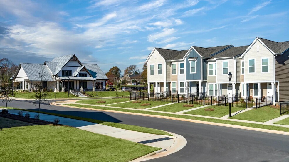 The community boasts an abundance of vibrant, well-maintained greenery. - Amavi Mooresville