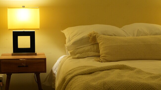 The second bedroom is lit with ambient light. - 4160 Barrett Rd