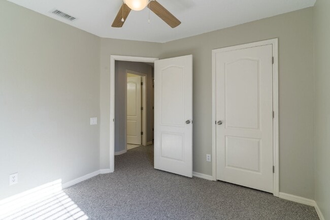 Building Photo - Beautiful 4/2 home Located on a tree lined street in the gate of country club community of the Hu...