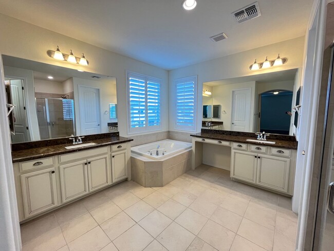 Building Photo - 4-bedroom, 4-bathroom home in the vibrant ...