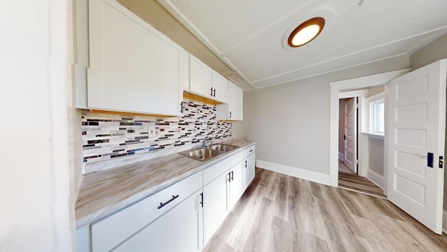 Building Photo - 7408 Dudley Ave