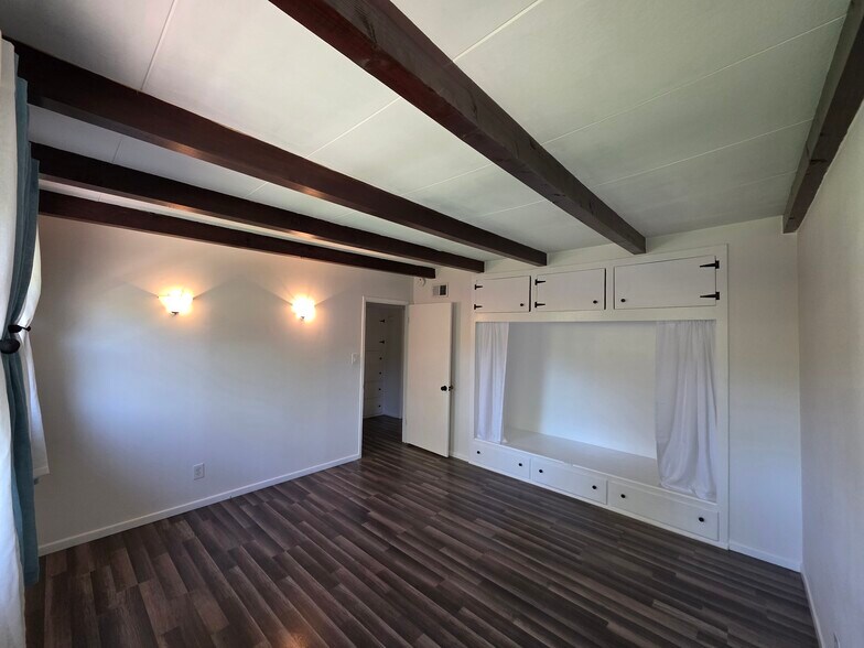 Bedroom 2 has a large closet with storage both above and below. - 456 E Indian Rock Rd