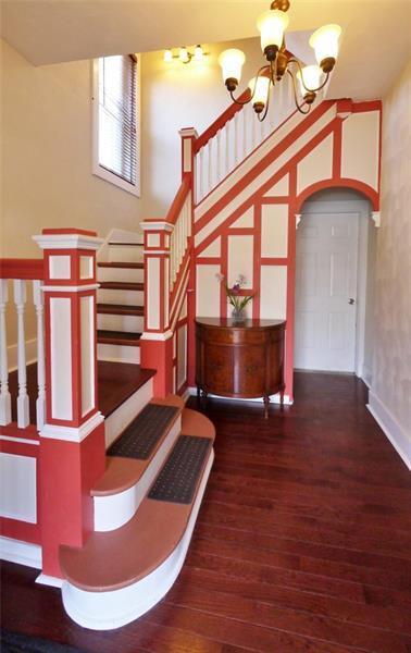 The house has a great entry way and staircase to welcome you home. - 1109 Haslage Ave