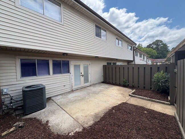 Building Photo - Four Bedroom Townhome Available Now