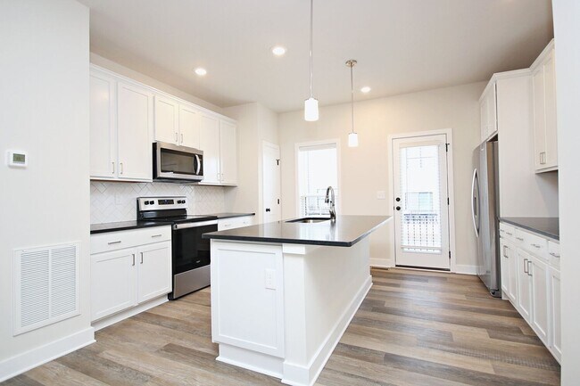 Building Photo - Dog-Friendly Old Trail Townhome - Walk To Local Shops, Restaurants, & More!