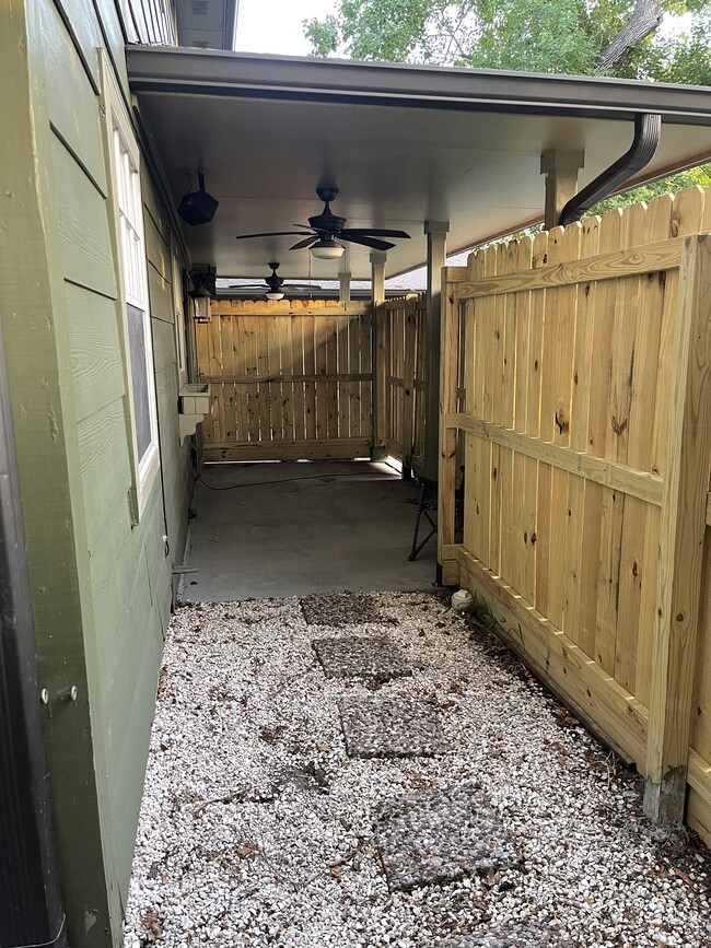 Outside covered patio with ceiling fan - 619 Sulphur St