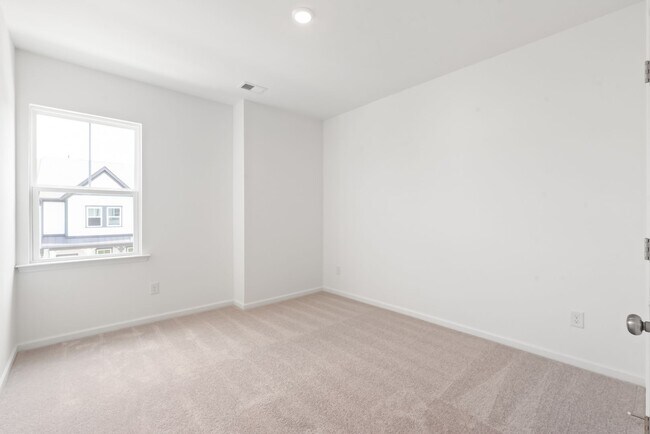 Building Photo - Welcome home to this stunning brand-new townhome in one of Indian Trail's newest and most desirab...