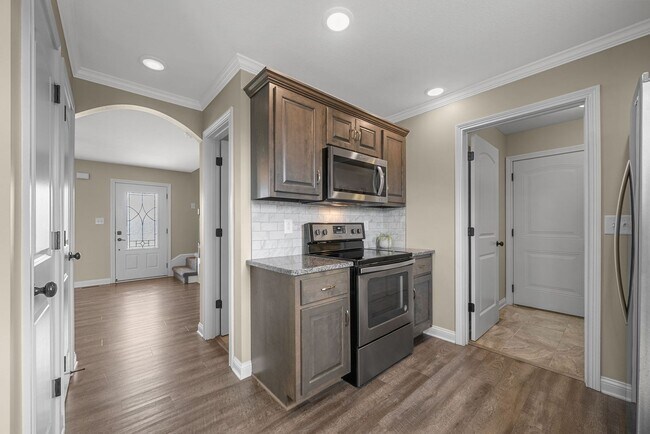 Building Photo - Spacious 4-Bedroom Home with Modern Upgrad...