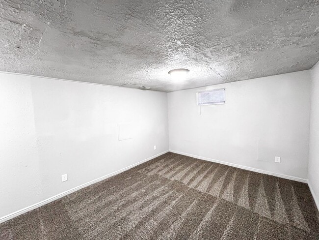 Building Photo - Spacious 5-Bedroom Home with Lofted Garage